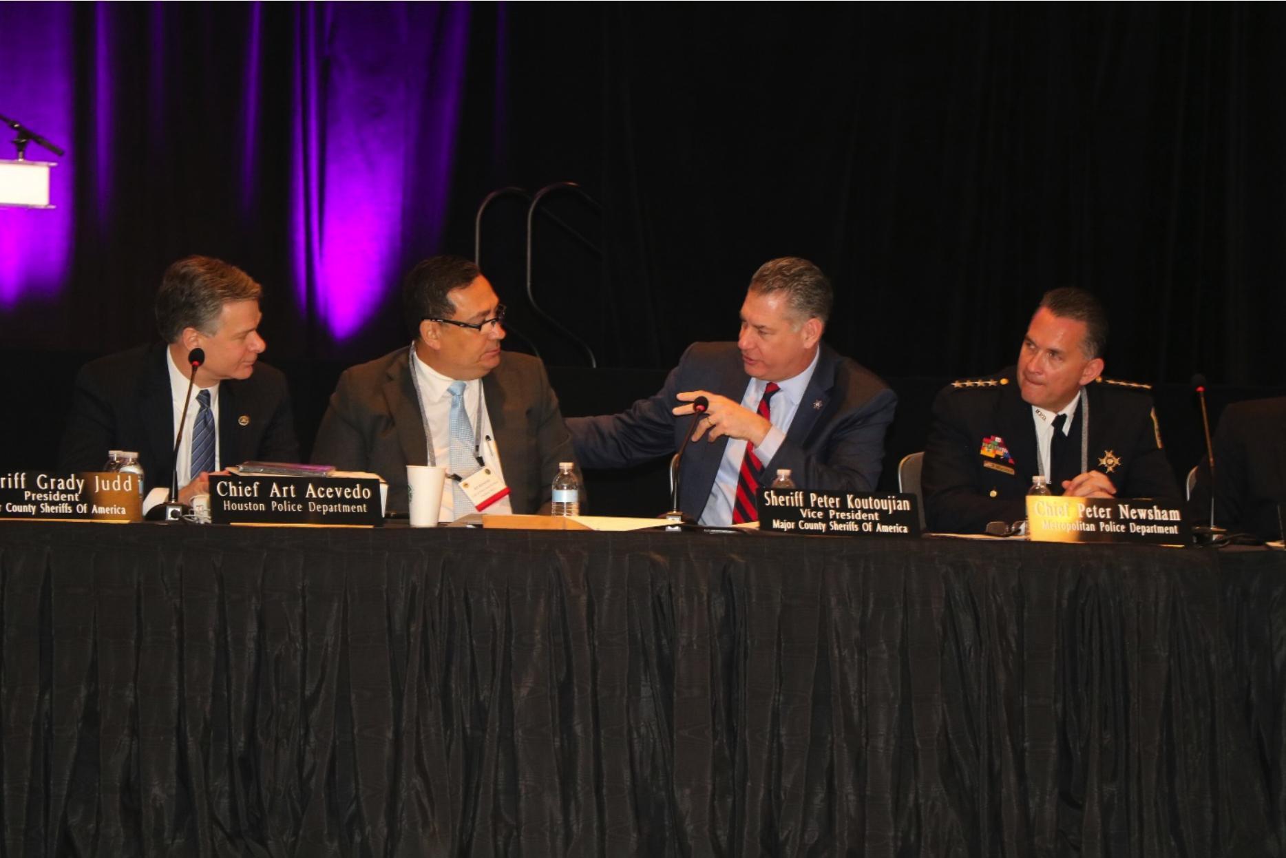 FBI Director Christopher A. Wray, Chief Art Acevedo, Sheriff Peter Koutoujian, and Chief Peter Newsham.